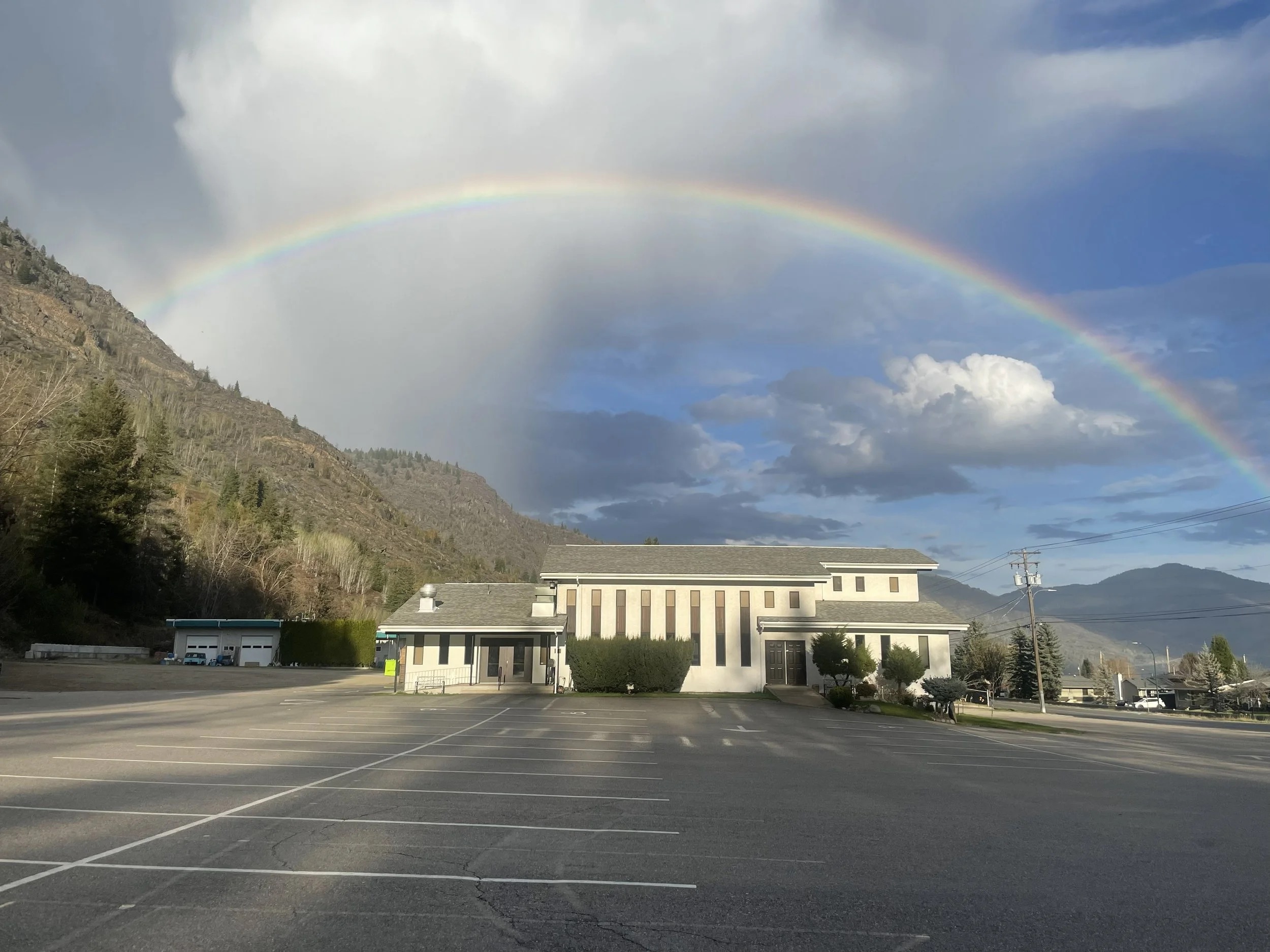 Trail Alliance Church on Laburnum Drive, with a rainbow over the mountain